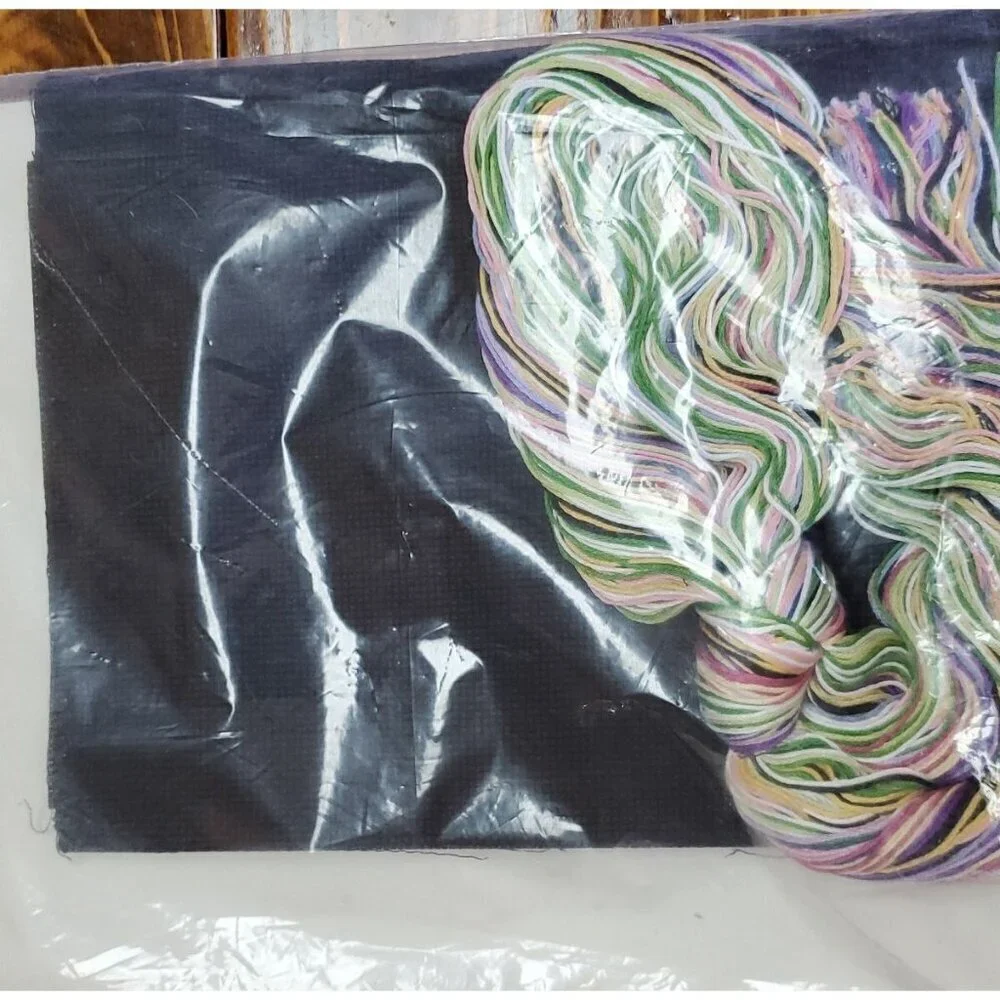 Something Special Counted Cross Stitch Kit #50687 wreath on black pillow.